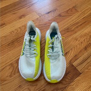 Blue and green hoka sneakers